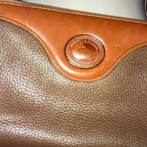 Dooney & Bourke vintage zip top shoulder bag.